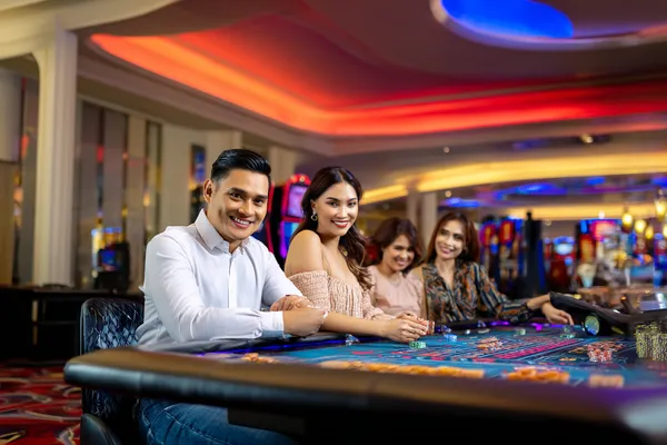 A glamorous woman holding casino chips in a neon-lit environment, representing the premium online casino atmosphere of 334OK.