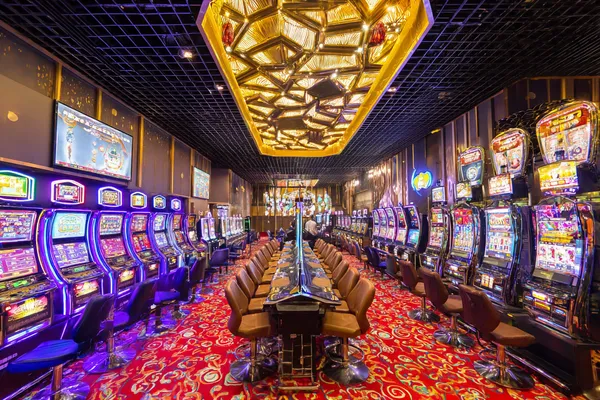 A close-up shot of golden coins falling around a spinning roulette wheel, representing immersive casino action at 334OK.
